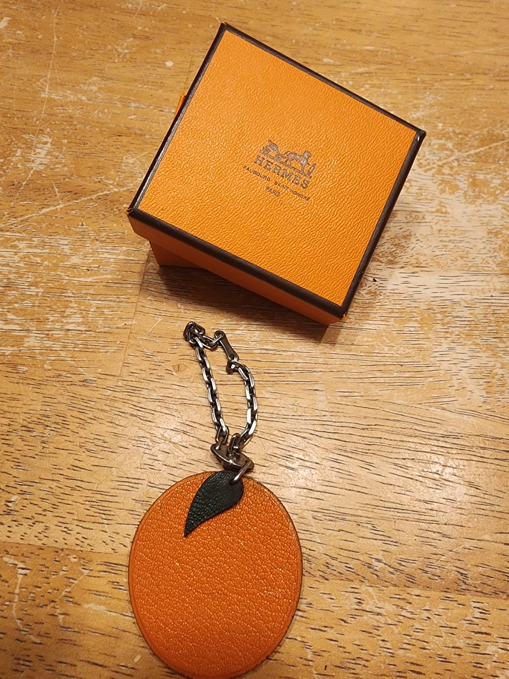 authentic Hermès orange fruit leather bag charm and keychain